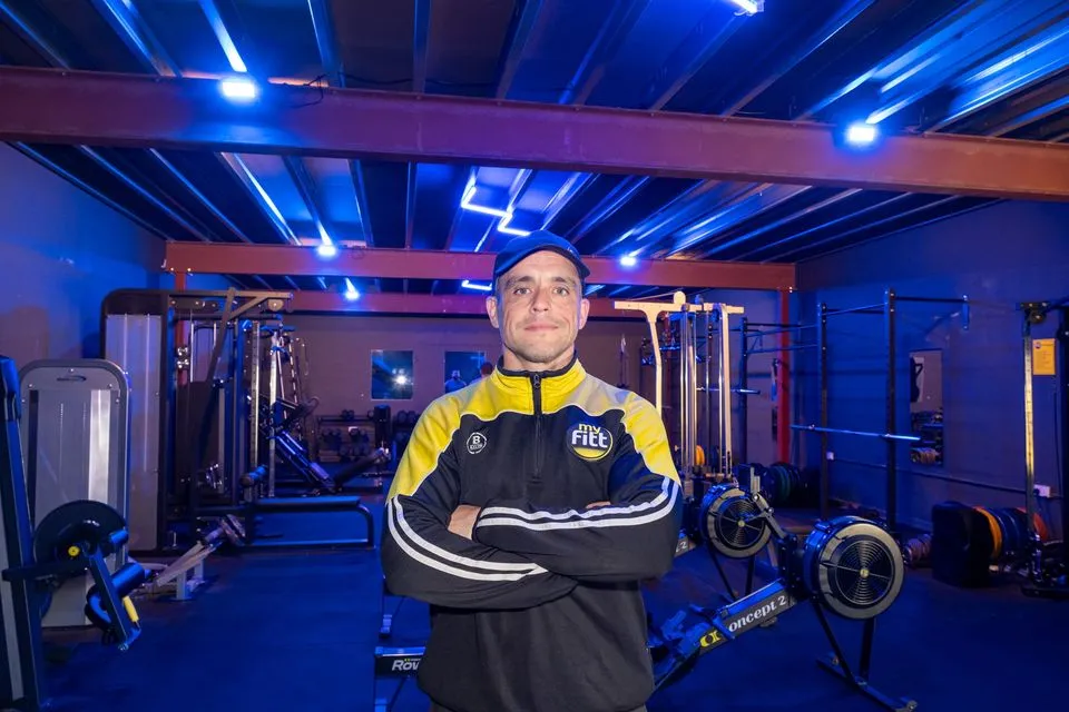 The gym's owner standing facing the camera, with the Rathnew gym floor behind him.